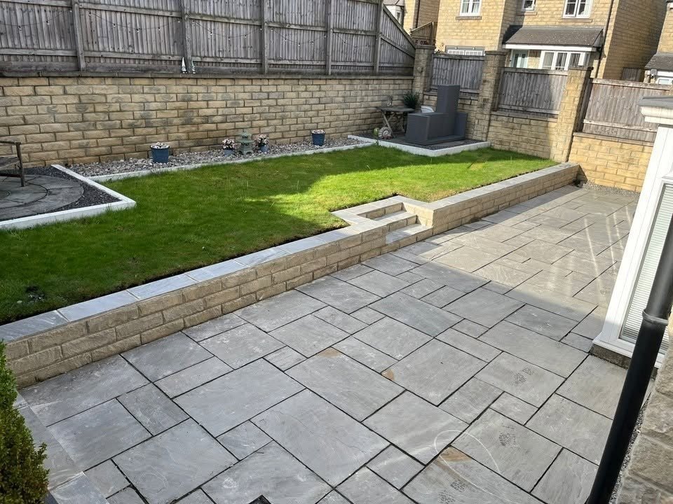 Completed raised lawn, retaining wall and patio