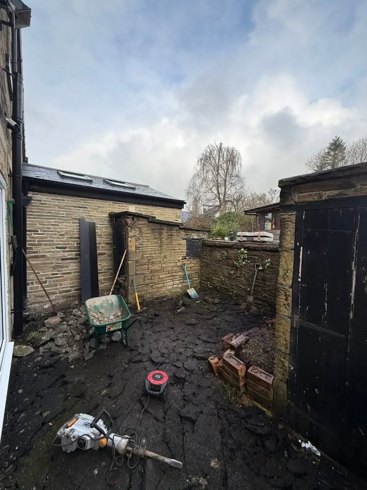 Small rear yard before paving transformation